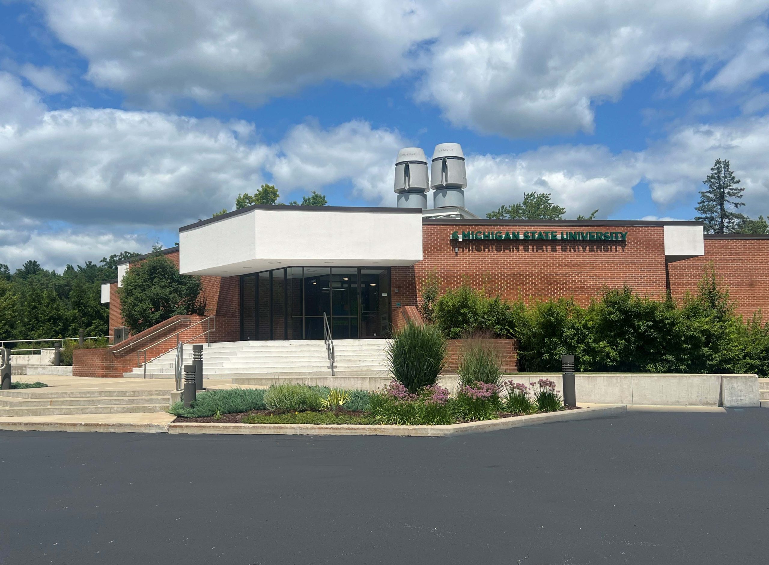 Photo of building with Michigan State University on brick